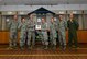 U.S. Air Force Capt. Bill Harris, the 509th Security Forces Squadron logistics officer in charge, center right, receives a Whiteman Company Grade Officer Council (CGOC) Bars and Stars award from members of the CGOC and Col. Mark Ely, the 509th Bomb Wing vice commander, at Whiteman Air Force Base, Mo., April 7, 2017. Harris consistently engaged with his troops and provided them with the resources needed to cope with the loss of a fellow Airman. He also organized his section to provide a weapons and vehicle demonstration to 13 kids from the youth center as part of a local outreach event. (U.S. Air Force photo by Airman 1st Class Jazmin Smith)
