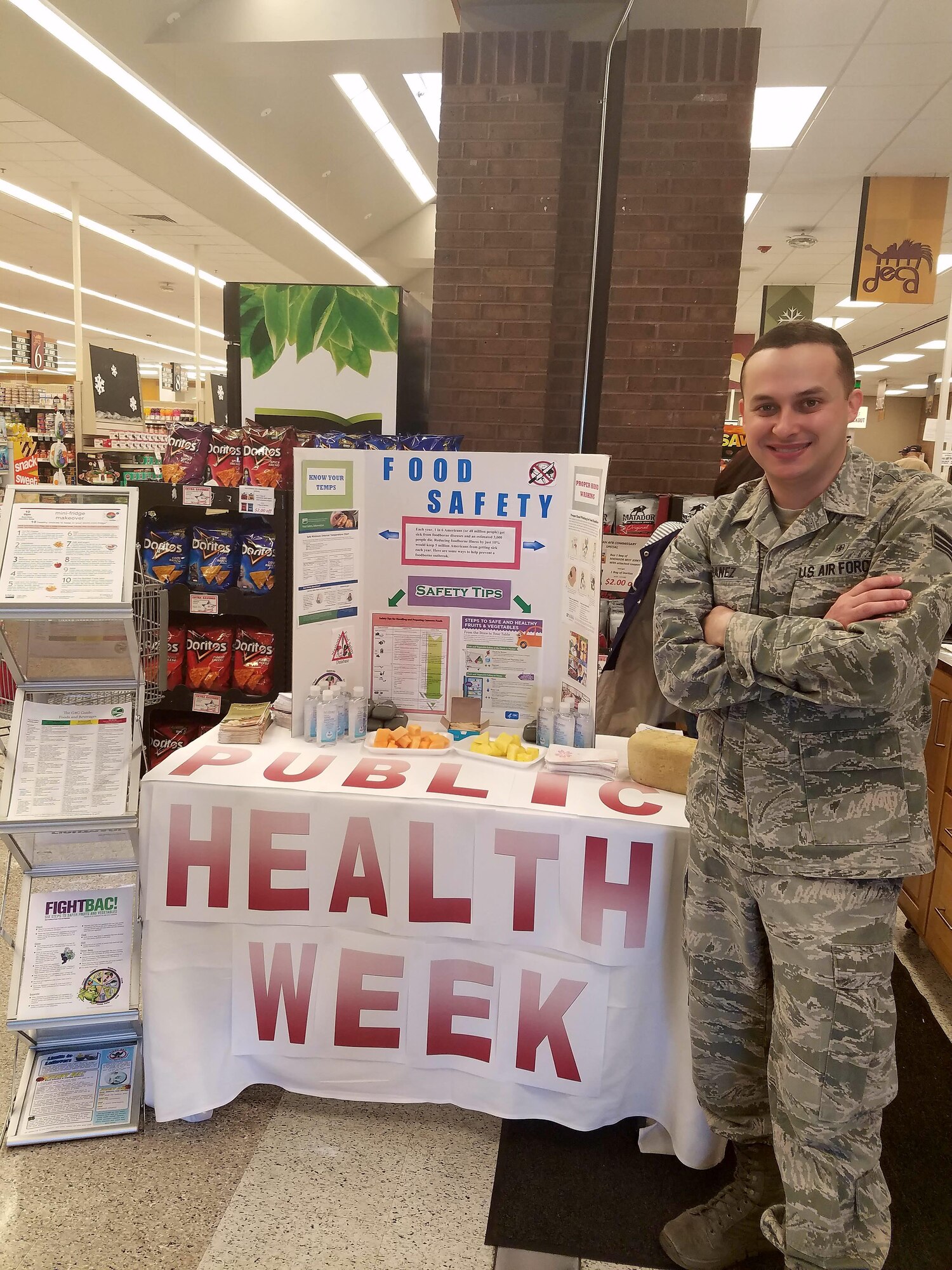 U.S. Air Force Senior Airman Anthony Ibanez, a public health technician assigned to the 509th Medical Operations Squadron, presents information on proper food handling procedures during Public Health Week at Whiteman Air Force Base, Mo., April 7, 2017. During Public Health Week the technicians focused on three main topics to spread health awareness to the base populace: entomology, hand washing and food safety. (Courtesy photo by Samita Bhandari)