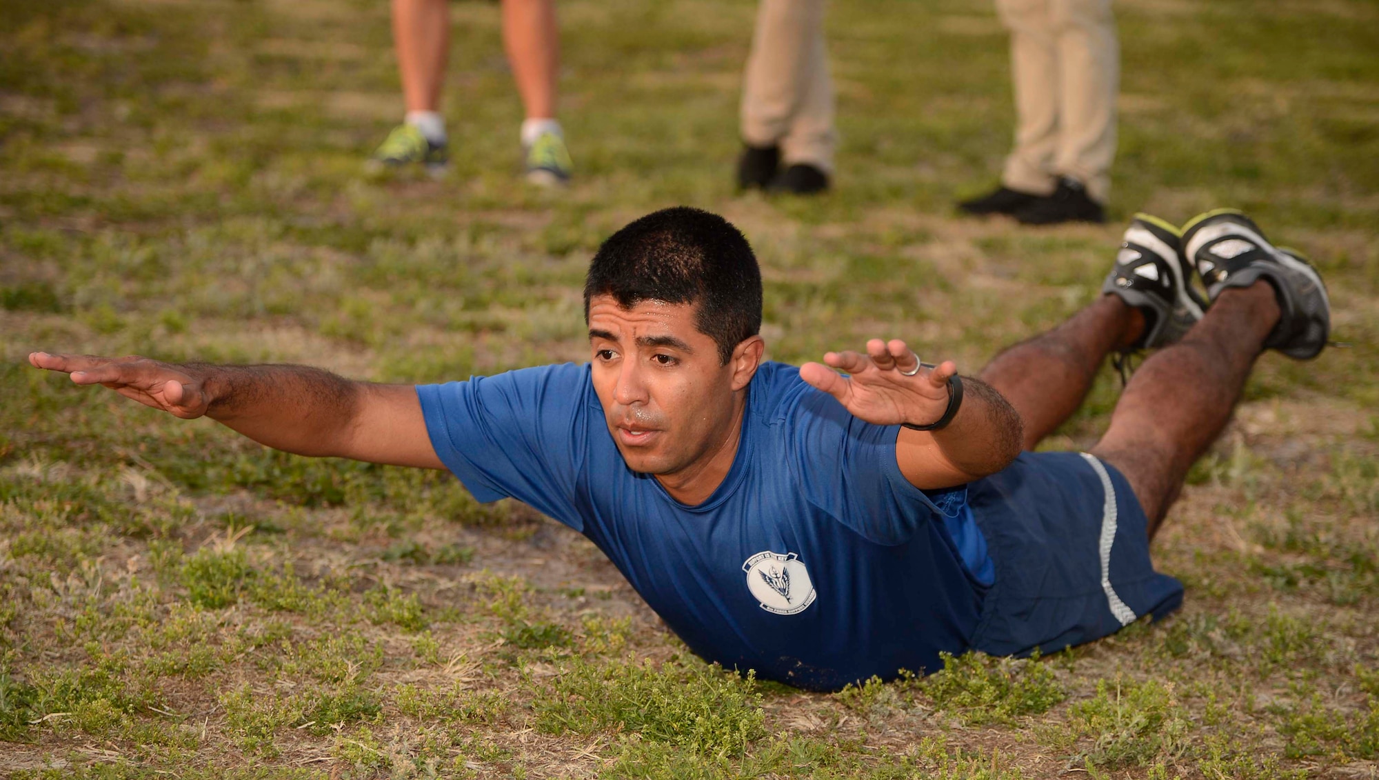 U.S. Air Force Lt. Col. Sergio Rios, commander of the 6th Force Support Squadron, performs a “superman” exercise during an Alpha Warrior Celebrity Workout at MacDill Air Force Base, Fla., April 19, 2017. Members of the Alpha Warrior team visited MacDill as the first stop on the Air Force Alpha Warrior tour. (U.S. Air Force photo by Staff Sgt. Vernon L. Fowler Jr.)