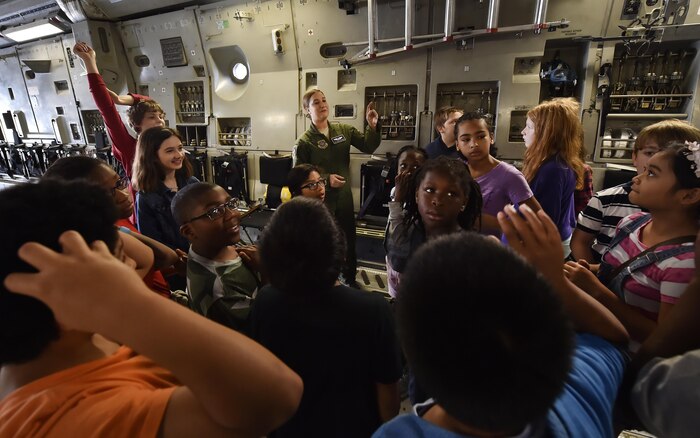 Senior Airman Kayla Zahneis, 14th Airlift Squadron loadmaster, talks to 5th-grade students from Sedgefield Intermediate School during a tour of a C-17 Globemaster as part of a career day event at Joint Base Charleston, S.C., April 20, 2017. The students talked to Airmen and participated in various career field specific demonstrations alongside subject matter experts from various units on the installation. Junior Reserve Officer Training Corps members from Fort Dorchester High School, Orangeburg Wilkinson High School, Summerville High School and Military Magnet Academy were also attended the event.