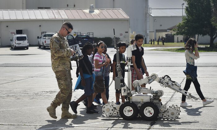 Staff Sgt. Joshua Rickert, 628th Civil Engineer Squadron explosive ordinance, disposal, shows 5th-grade students from Sedgefield Intermediate School basic functions of an F6A robot as part of a career day event at Joint Base Charleston, S.C., April 20, 2017. The students talked to Airmen and participated in various career field specific demonstrations alongside subject matter experts from various units on the installation. Junior Reserve Officer Training Corps members from Fort Dorchester High School, Orangeburg Wilkinson High School, Summerville High School and Military Magnet Academy were also attended the event.