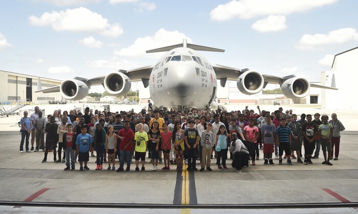 Fifth grade students from Sedgefield Intermediate School stand in front of a C-17 Globemaster after finishing a career day event at Joint Base Charleston, S.C., April 20, 2017. The students talked to Airmen and participated in various career field specific demonstrations alongside subject matter experts from various units on the installation. Junior Reserve Officer Training Corps members from Fort Dorchester High School, Orangeburg Wilkinson High School, Summerville High School and Military Magnet Academy also attended the event. 