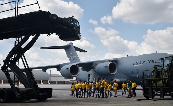Senior Airman Brett Lovejoy, 437th Aerial Port Squadron air cargo services, explains the basics of his career field to Junior Reserve Officer Training Corps members, Summerville High School, during a career day event at Joint Base Charleston, S.C., April 20, 2017. The JROTC members talked to Airmen and participated in various career field specific demonstrations alongside subject matter experts from various units on the installation. Fifth grade students from Sedgefield Intermediate School also attended the event.