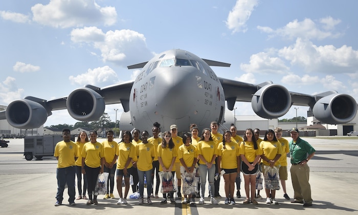 Junior Reserve Officer Training Corps members, Summerville High School, stand in front of a C-17 Globemaster after finishing a career day event at Joint Base Charleston, S.C., April 20, 2017. The JROTC members talked to Airmen and participated in various career field specific demonstrations alongside subject matter experts from various units on the installation. Fifth grade students from Sedgefield Intermediate School also attended the event.