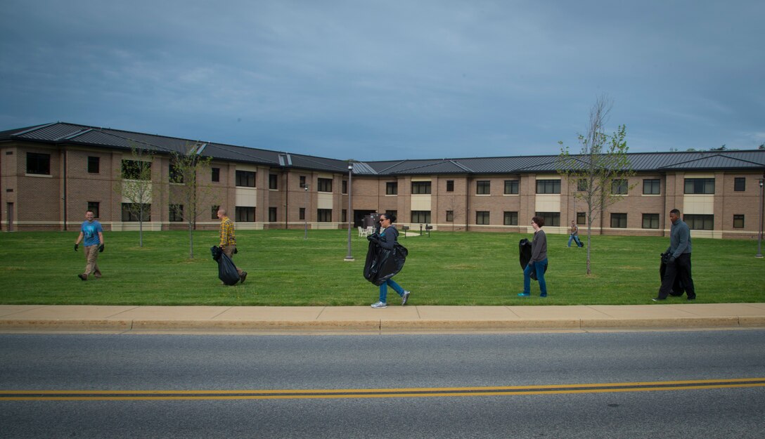 Airmen pick up trash during Earth Week at Joint Base Andrews, Md., April 19, 2017. The week also included a tree-planting ceremony, seed planting, a youth art display and more. (U.S. Air Force photo by Senior Airman Mariah Haddenham)