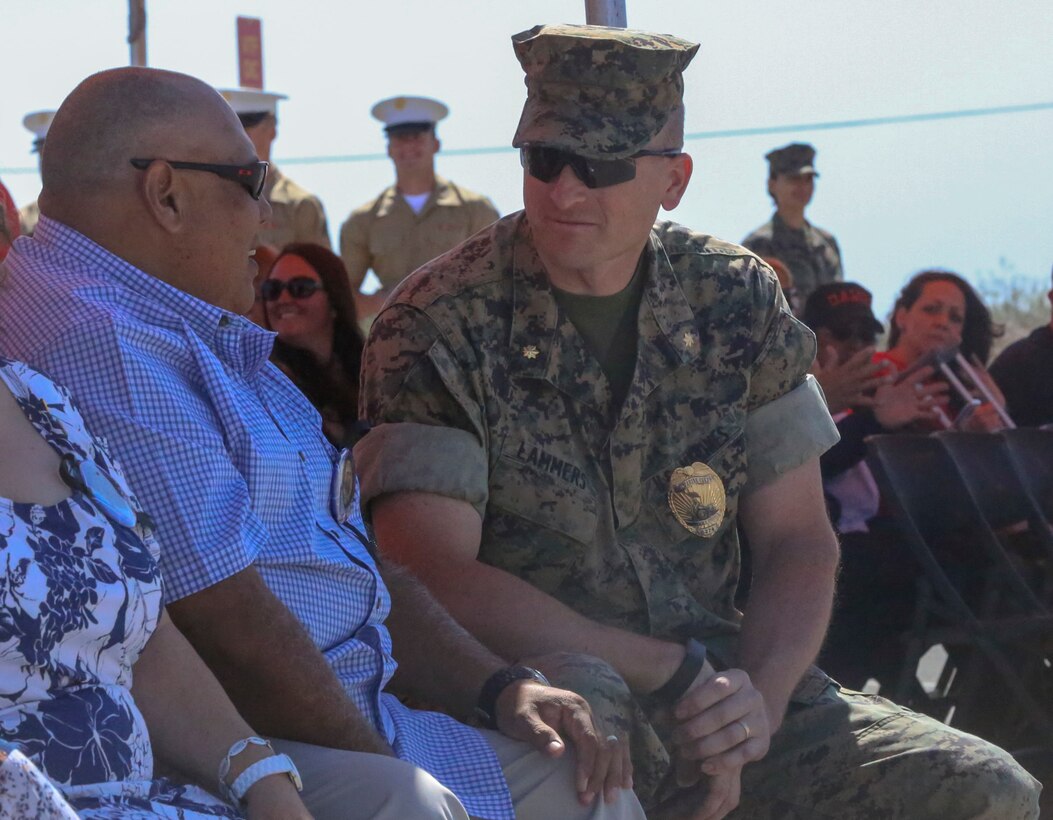 Maj. Daniel Lammers, Provost Marshal, Marine Corps Air Ground Combat Center, Twentynine Palms, Calif., speaks to Salvador Diaz, father of Staff Sgt. Christopher Diaz, during the renaming ceremony of Calcite Road to Diaz Road, April 14, 2017. The road was renamed in honor of Staff Sgt. Diaz, who made the ultimate sacrifice to help a brother in arms while conducting combat operations in Helmand Province, Afghanistan in support of Operation Enduring Freedom. (U.S. Marine Corps photo by Cpl. Medina Ayala-Lo)