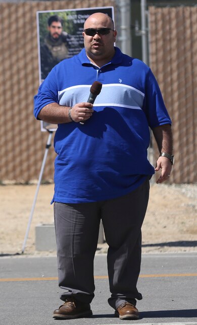 Ray Diaz, Staff Sgt. Christopher Diaz’s older brother, gives his remarks during the renaming ceremony of Calcite Road to Diaz Road, April 14, 2017, aboard the Marine Corps Air Ground Combat Center, Twentynine Palms, Calif. The road was renamed in honor of Staff Sgt. Diaz who made the ultimate sacrifice to help a brother in arms while conducting combat operations in Helmand Province, Afghanistan in support of Operation Enduring Freedom. (U.S. Marine Corps photo by Cpl. Medina Ayala-Lo)