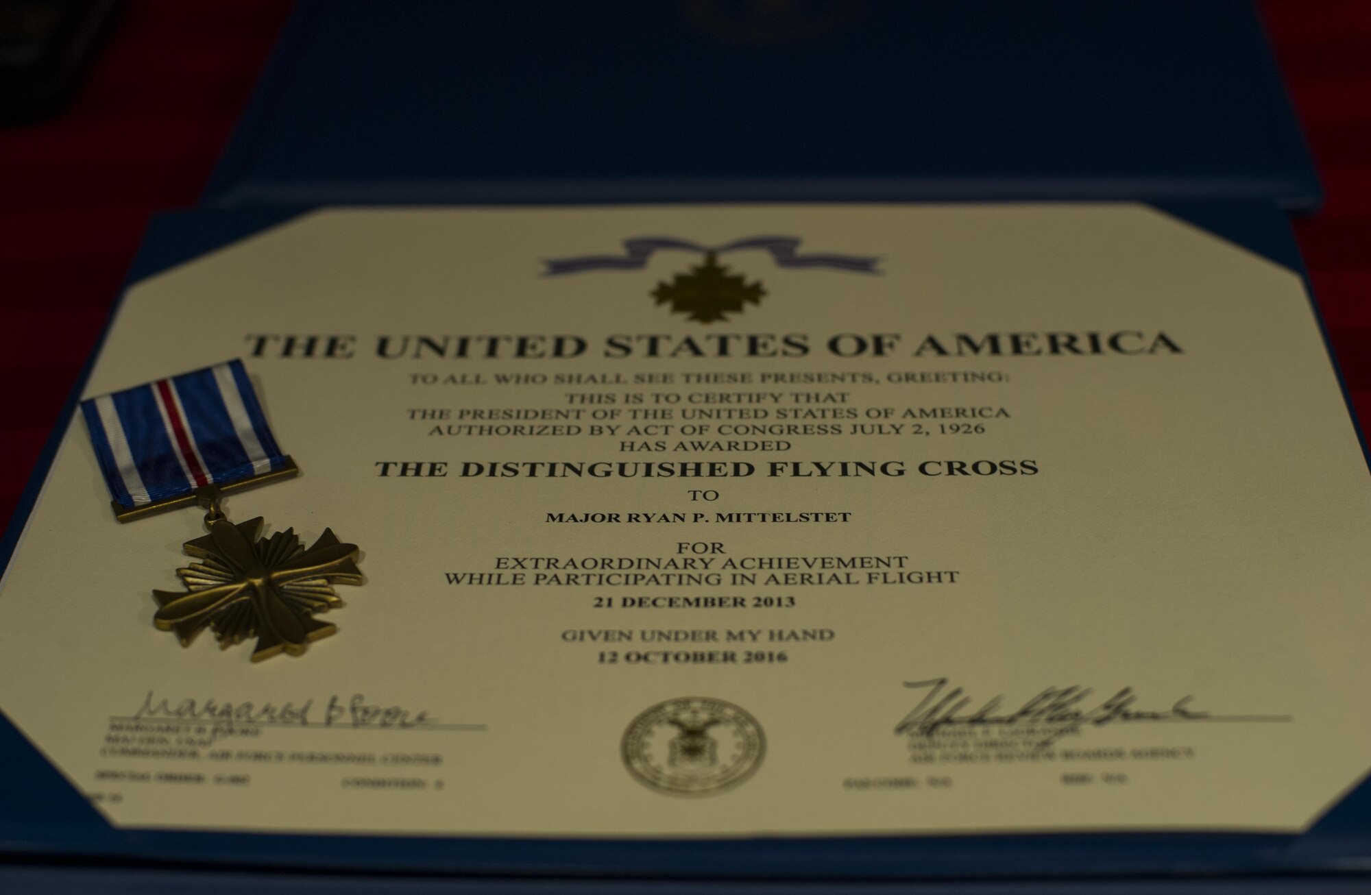 Maj. Ryan Mittelstet, Maj. Brett Cassidy and Tech. Sgt. Christopher Nin were awarded the Distinguished Flying Cross during a ceremony at Hurlburt Field, Fla., April 21, 2017. While assigned to the 8th Expeditionary Special Operations Squadron, Mittelstet, Cassidy and Nin were onboard a CV-22 Osprey conducting a mission to evacuate American citizens during a civil war in Africa. While attempting the evacuation, their aircraft was targeted and hit more than 50 times by surface-to-air fire from ground forces. (U.S. Air Force photo by Airman 1st Class Joseph Pick)