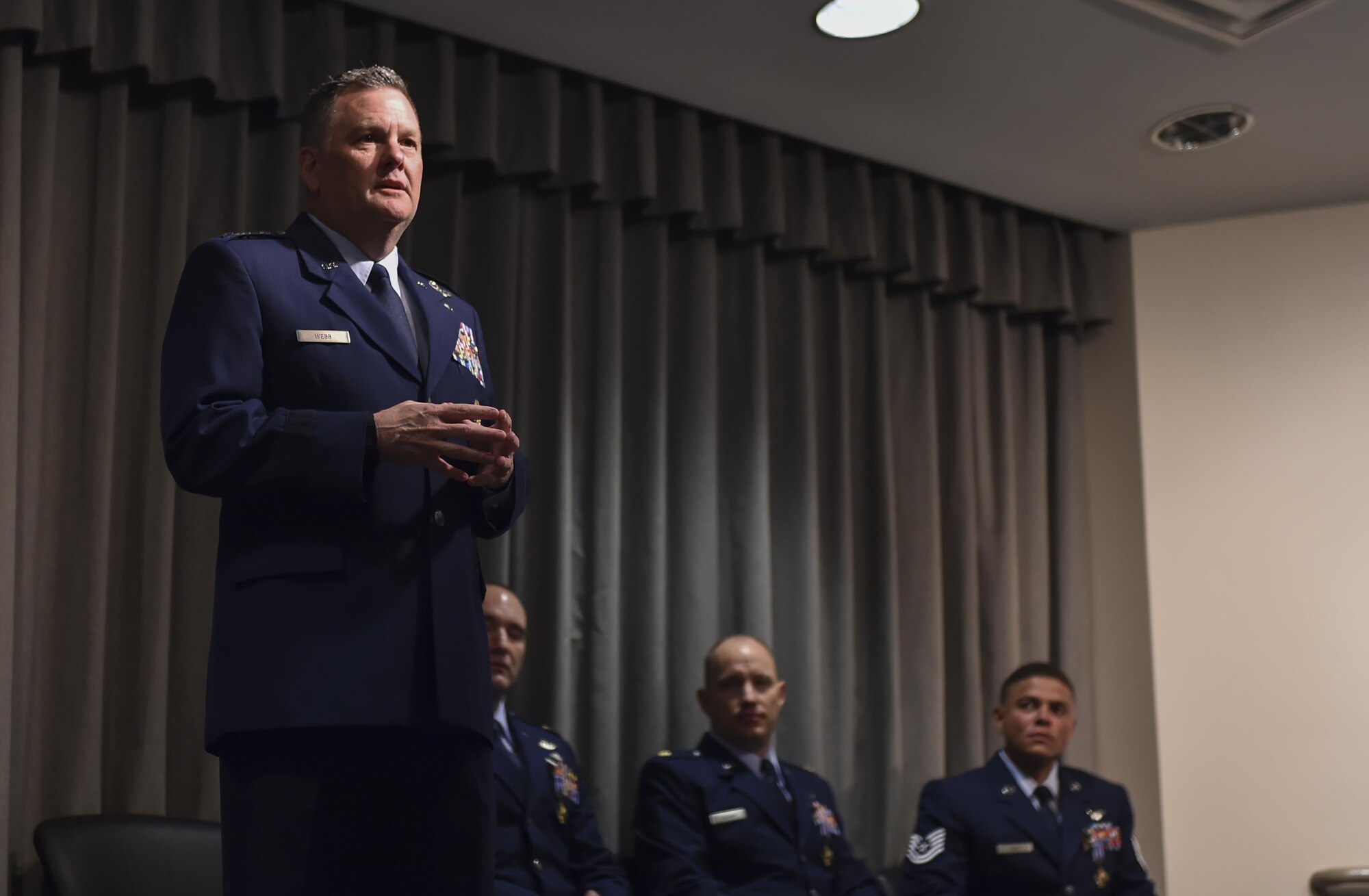 Lt. Gen. Brad Webb, commander of Air Force Special Operations Command, speaks during a Distinguished Flying Cross Ceremony for Maj. Ryan Mittelstet, Maj. Brett Cassidy and Tech. Sgt. Christopher Nin at Hurlburt Field, Fla., April 21, 2017. While assigned to the 8th Expeditionary Special Operations Squadron, Mittelstet, Cassidy and Nin were onboard a CV-22 Osprey conducting a mission to evacuate American citizens during a civil war in Africa. While attempting the evacuation, their aircraft was targeted and hit more than 50 times by surface-to-air fire from ground forces. (U.S. Air Force photo by Airman 1st Class Joseph Pick)