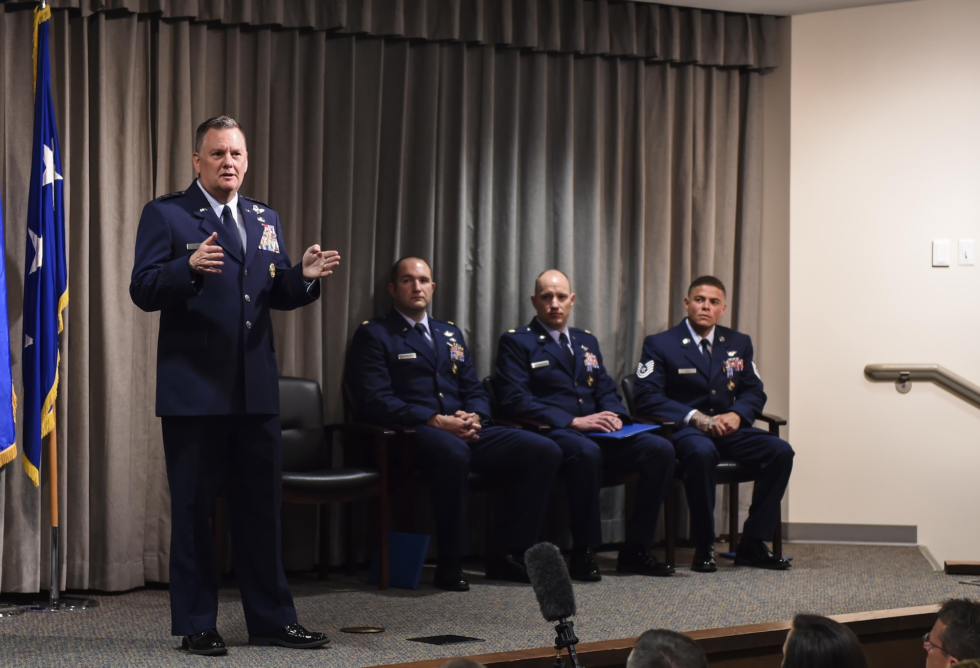 Lt. Gen. Brad Webb, commander of Air Force Special Operations Command, speaks during a Distinguished Flying Cross Ceremony for Maj. Ryan Mittelstet, Maj. Brett Cassidy and Tech. Sgt. Christopher Nin at Hurlburt Field, Fla., April 21, 2017. While assigned to the 8th Expeditionary Special Operations Squadron, Mittelstet, Cassidy and Nin were onboard a CV-22 Osprey conducting a mission to evacuate American citizens during a civil war in Africa. While attempting the evacuation, their aircraft was targeted and hit more than 50 times by surface-to-air fire from ground forces. (U.S. Air Force photo by Airman 1st Class Joseph Pick)