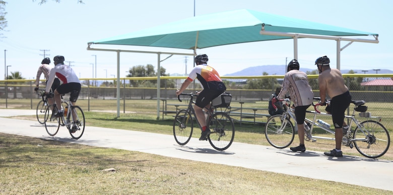 Participants of the annual Earth Day Fun Bike Ride take off from Felix Field aboard Marine Corps Air Ground Combat Center Twentynine Palms, Calif., April 13, 2017. Natural Resources and Environmental Affairs hosts the event annually to raise environmental awareness of Combat Center residents and the local community in the weeks leading up to Earth Day. (U.S. Marine Corps photo by Lance Cpl. Natalia Cuevas)