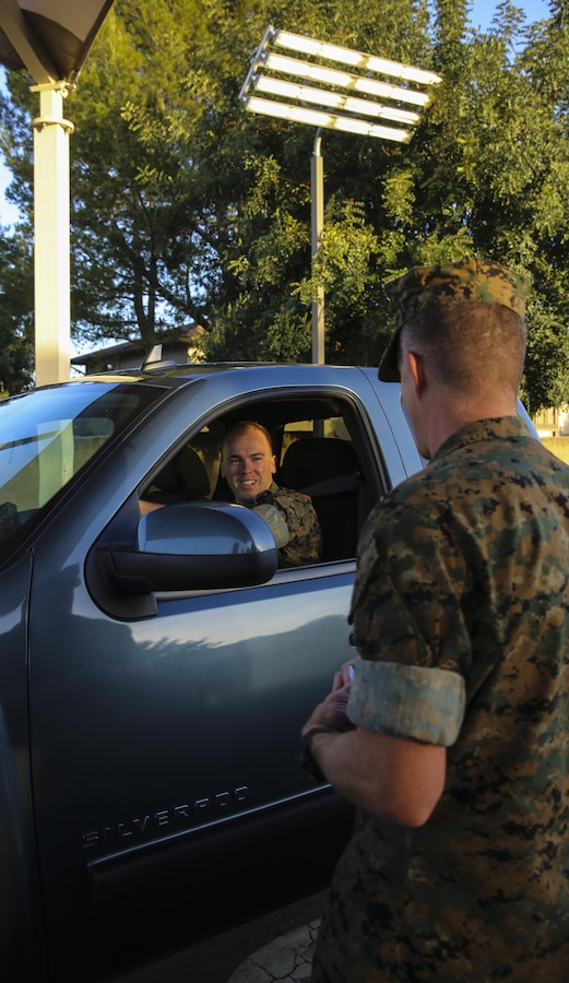Col. Jason Woodworth, commanding officer of Marine Corps Air Station Miramar, Calif., welcomes a Marine to work at the North Gate on MCAS Miramar, April 21. Woodworth, along with Maj. Gen. Mark Wise, commanding general of 3rd Marine Aircraft Wing, Sgt. Maj. James Porterfield, sergeant major of 3rd MAW, and Sgt. Maj. Michael Walton, sergeant major of MCAS Miramar, welcomed service members and civilian employees traveling through the gate to raise awareness of Sexual Assault and Prevention month. “It is the responsibility of every member of the command to prevent and report incidents of sexual assault,” said Woodworth. “Treat each other as you want to be treated and remember to do the right thing the first time, every time.” (Marine Corps photo by Sgt. Kimberlyn Adams/Released)