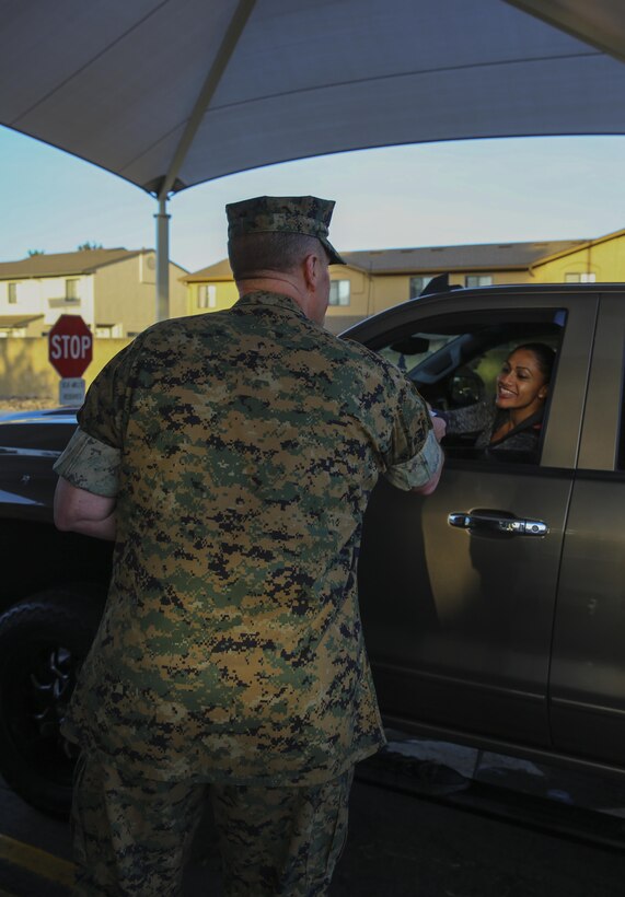Maj. Gen. Mark Wise, commanding general of 3rd Marine Aircraft Wing, welcomed service members and civilian employees to work at the North Gate on Marine Corps Air Station Miramar, Calif., April 21.Wise, along with Col. Jason Woodworth, commanding general of MCAS Miramar, Sgt. Maj. James Porterfield, sergeant major of 3rd MAW, and Sgt. Maj. Michael Walton, sergeant major of MCAS Miramar, welcomed everyone traveling through the gate to raise awareness of Sexual Assault and Prevention month. “It is the responsibility of every member of the command to prevent and report incidents of sexual assault,” said Woodworth. “Treat each other as you want to be treated and remember to do the right thing the first time, every time.” (Marine Corps photo by Sgt. Kimberlyn Adams/Released)