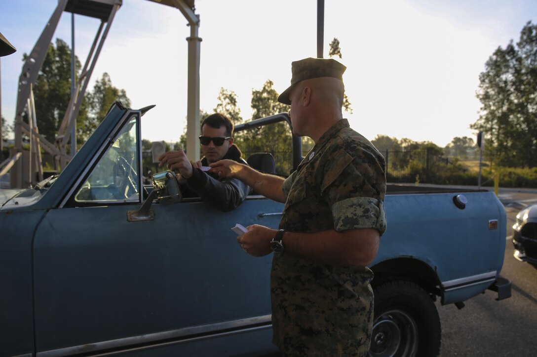 Sgt. Maj. Michael Walton, sergeant major of Marine Corps Air Station Miramar, Calif., welcomes a Marine to work at the East Gate on MCAS Miramar, April 21. Walton, along with Maj. Gen. Mark Wise, commanding general of 3rd Marine Aircraft Wing, Col. Jason Woodworth, commanding officer of MCAS Miramar and Sgt. Maj. James Porterfield, sergeant major of 3rd MAW, welcomed service members and civilian employees traveling through the gate to raise awareness of Sexual Assault and Prevention month. “It is the responsibility of every member of the command to prevent and report incidents of sexual assault,” said Woodworth. “Treat each other as you want to be treated and remember to do the right thing the first time, every time.” (Marine Corps photo by Sgt. Kimberlyn Adams/Released)