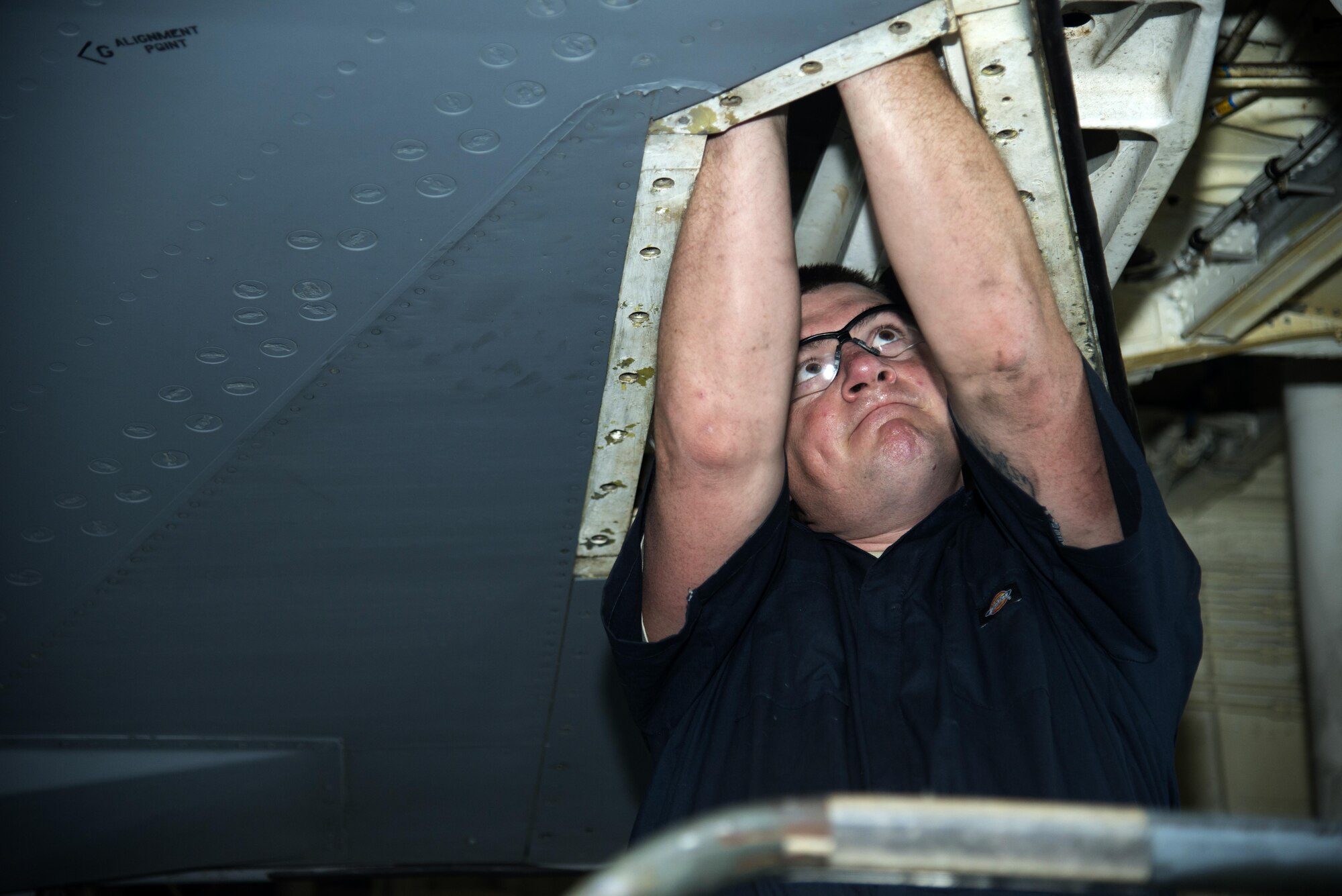 U.S. Air Force Tech. Sgt. Patrick Register, aerospace repair technician assigned to the 6th Maintenance Squadron, reaches inside of a KC-135 Stratotanker aircraft to check for cracks in the metal, April 10, 2017, at MacDill Air Force Base, Fla. Register followed technical orders for the task to ensure the job was completed timely and accurately. (U.S. Air Force photo by Airman 1st Class Rito Smith) 