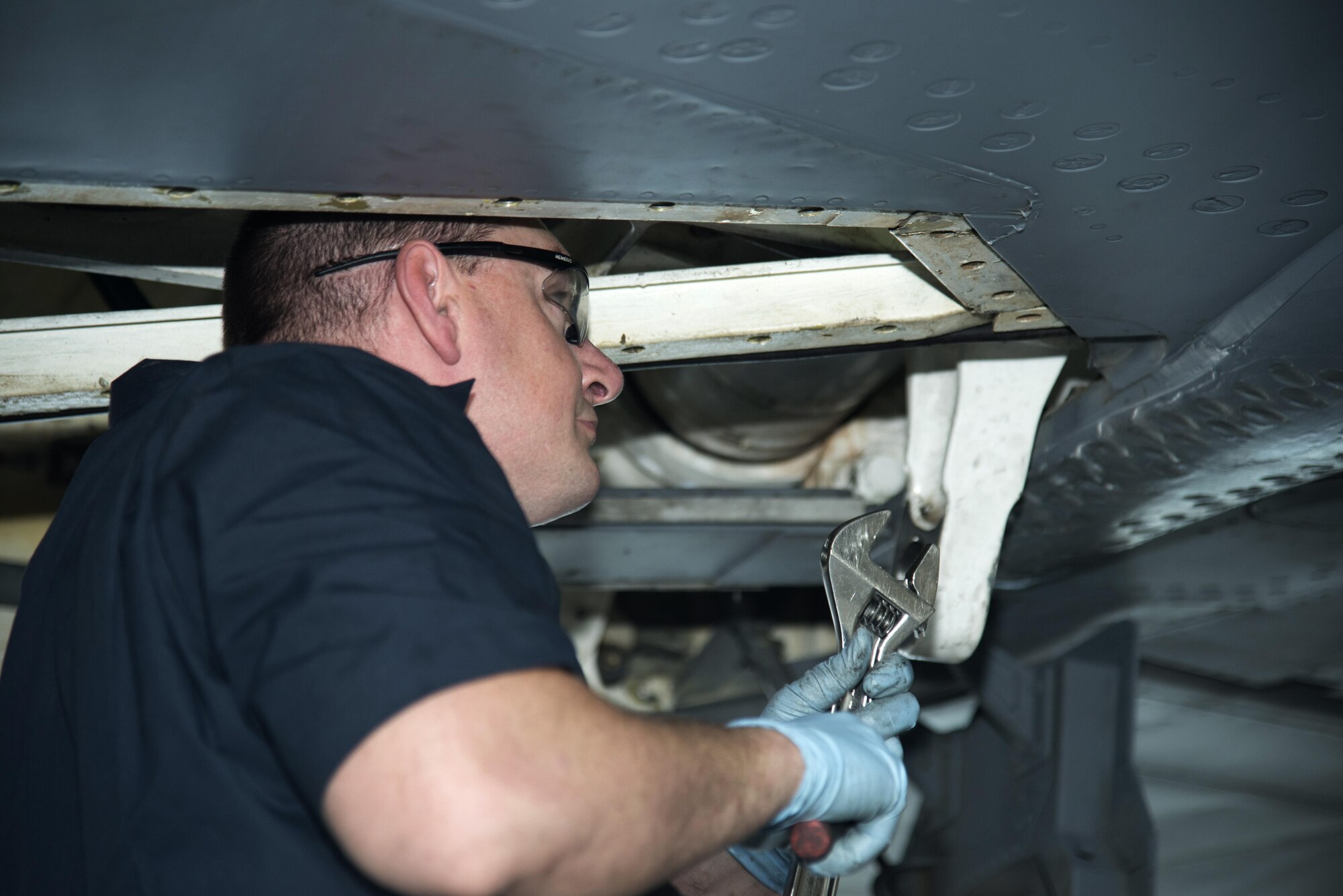 U.S. Air Force Tech. Sgt. Patrick Register, an aerospace repair technician assigned to the 6th Maintenance Squadron, removes bolts on a KC-135 Stratotanker aircraft April 10, 2017, at MacDill Air Force Base, Fla. Register took panels off the inside of the aircraft to inspect for cracks in the frame. (U.S. Air Force photo by Airman 1st Class Rito Smith) 