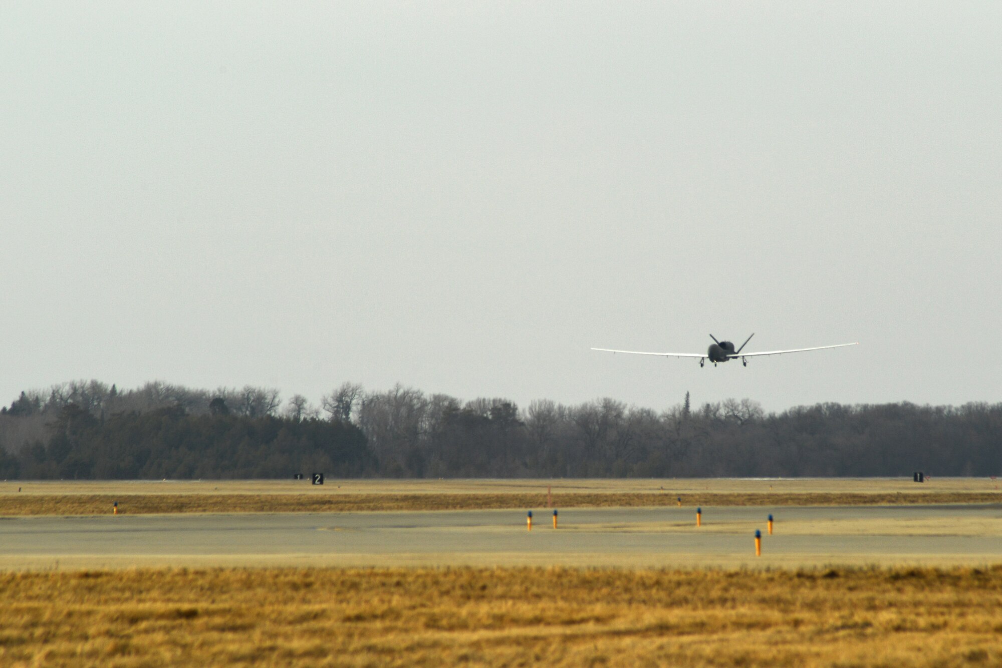 An RQ-4 Global Hawk approaches the runway March 25, 2017, on Grand Forks Air Force Base, N.D. Airmen with the 69th Maintenance Squadron performed the first Air Force-led Mobile Automated Scanner scan on this aircraft, which allowed it to continue its part in supporting the combatant commands. (U.S. Air Force photo by Senior Airman Ryan Sparks)
