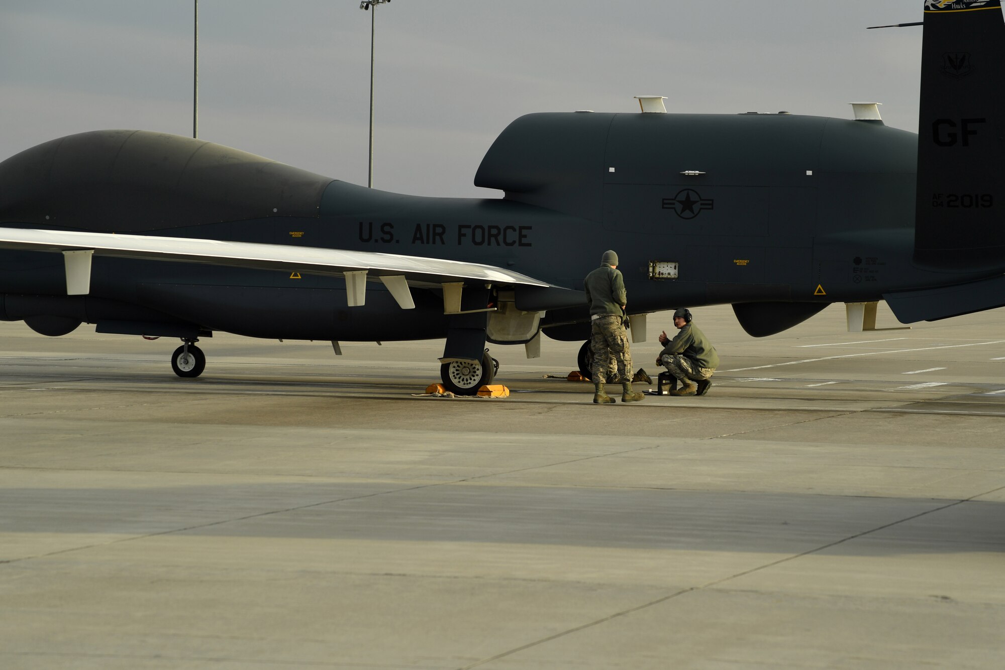Senior Airman Lain Baker, 69th Maintenance Squadron crew chief, gives the thumbs up during a post-flight recovery March 25, 2017, on Grand Forks Air Force Base, N.D. Airmen with the 69th Maintenance Squadron performed the first Air Force-led Mobile Automated Scanner scan on this aircraft, which allowed it to continue its part in supporting the combatant commands. (U.S. Air Force photo by Senior Airman Ryan Sparks)