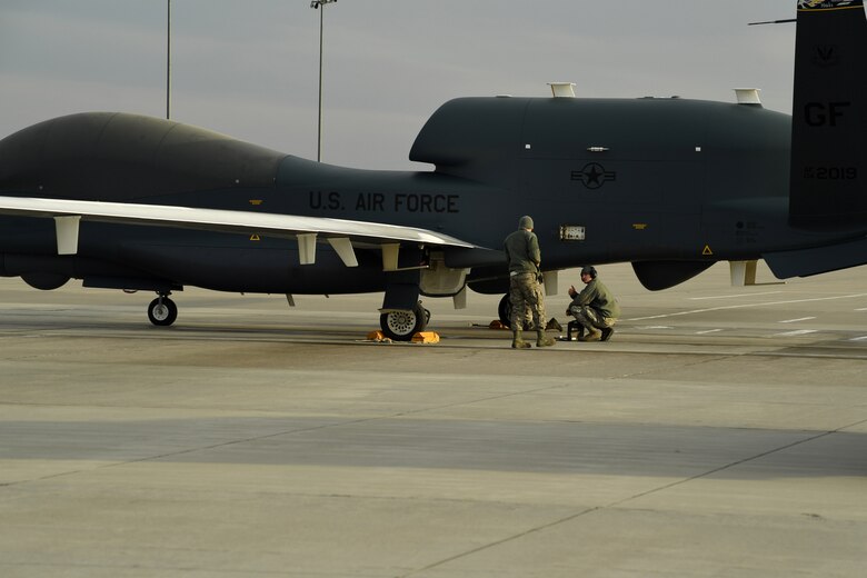 Senior Airman Lain Baker, 69th Maintenance Squadron crew chief, gives the thumbs up during a post-flight recovery March 25, 2017, on Grand Forks Air Force Base, N.D. Airmen with the 69th Maintenance Squadron performed the first Air Force-led Mobile Automated Scanner scan on this aircraft, which allowed it to continue its part in supporting the combatant commands. (U.S. Air Force photo by Senior Airman Ryan Sparks)