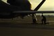 An Airman with the 69th Maintenance Squadron kneels beneath the wing of an RQ-4 Global Hawk March 25, 2017, on Grand Forks Air Force Base, N.D. Airmen with the 69th MXS performed the first Air Force-led Mobile Automated Scanner scan on this aircraft, which allowed it to continue its part in supporting the combatant commands. (U.S. Air Force photo by Senior Airman Ryan Sparks)