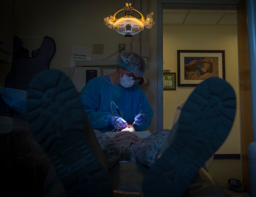 Staff Sgt. Kaitlynne Anzur, 779th Medical Group dental assistant, cleans a patients teeth following a dental check-up at Joint Base Andrews, Md., April 18, 2017. Anzur has been a dental assistant for approximately four years and will soon cross train to become an Air Force recruiter. (U.S. Air Force photo by Senior Airman Mariah Haddenham)