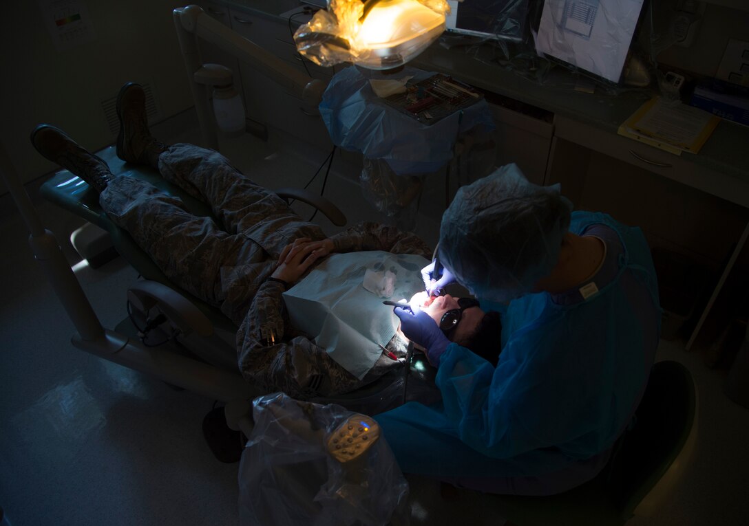 Staff Sgt. Kaitlynne Anzur, 779th Medical Group dental assistant, cleans a patients teeth following a dental check-up at Joint Base Andrews, Md., April 18, 2017. Anzur has been a dental assistant for approximately four years and will soon cross train to become an Air Force recruiter. (U.S. Air Force photo by Senior Airman Mariah Haddenham)