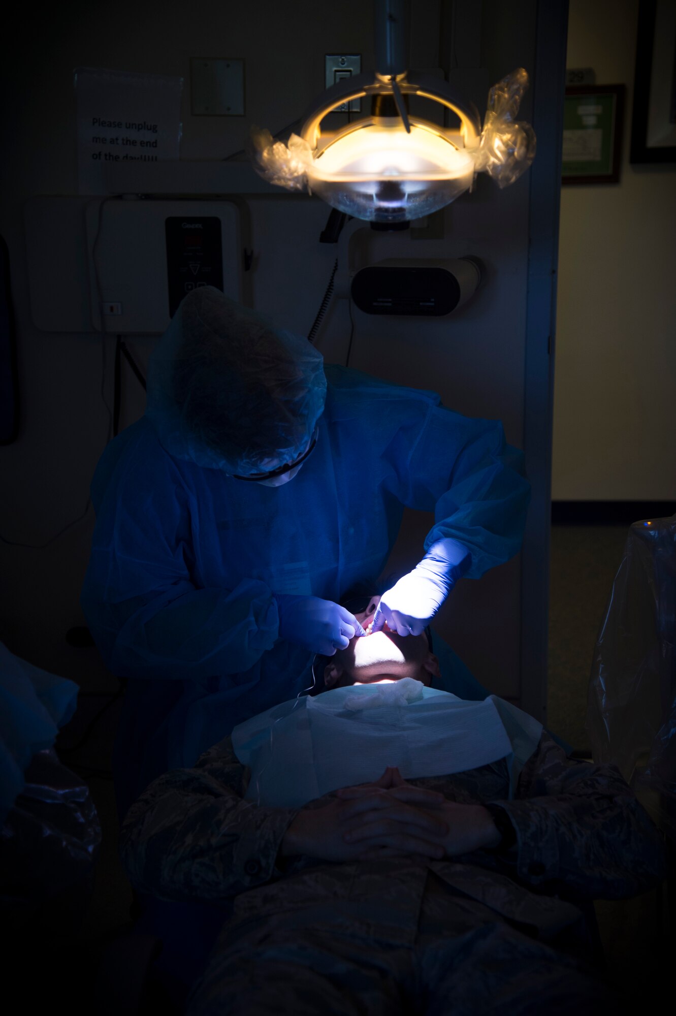 Staff Sgt. Kaitlynne Anzur, 779th Medical Group dental assistant, cleans a patients teeth following a dental check-up at Joint Base Andrews, Md., April 18, 2017. Dental assistants support general dentistry, periodontics, prosthodontics, orthodontics, endodontics and oral surgery while seeing approximately 2,000 patients a month. (U.S. Air Force photo by Senior Airman Mariah Haddenham)