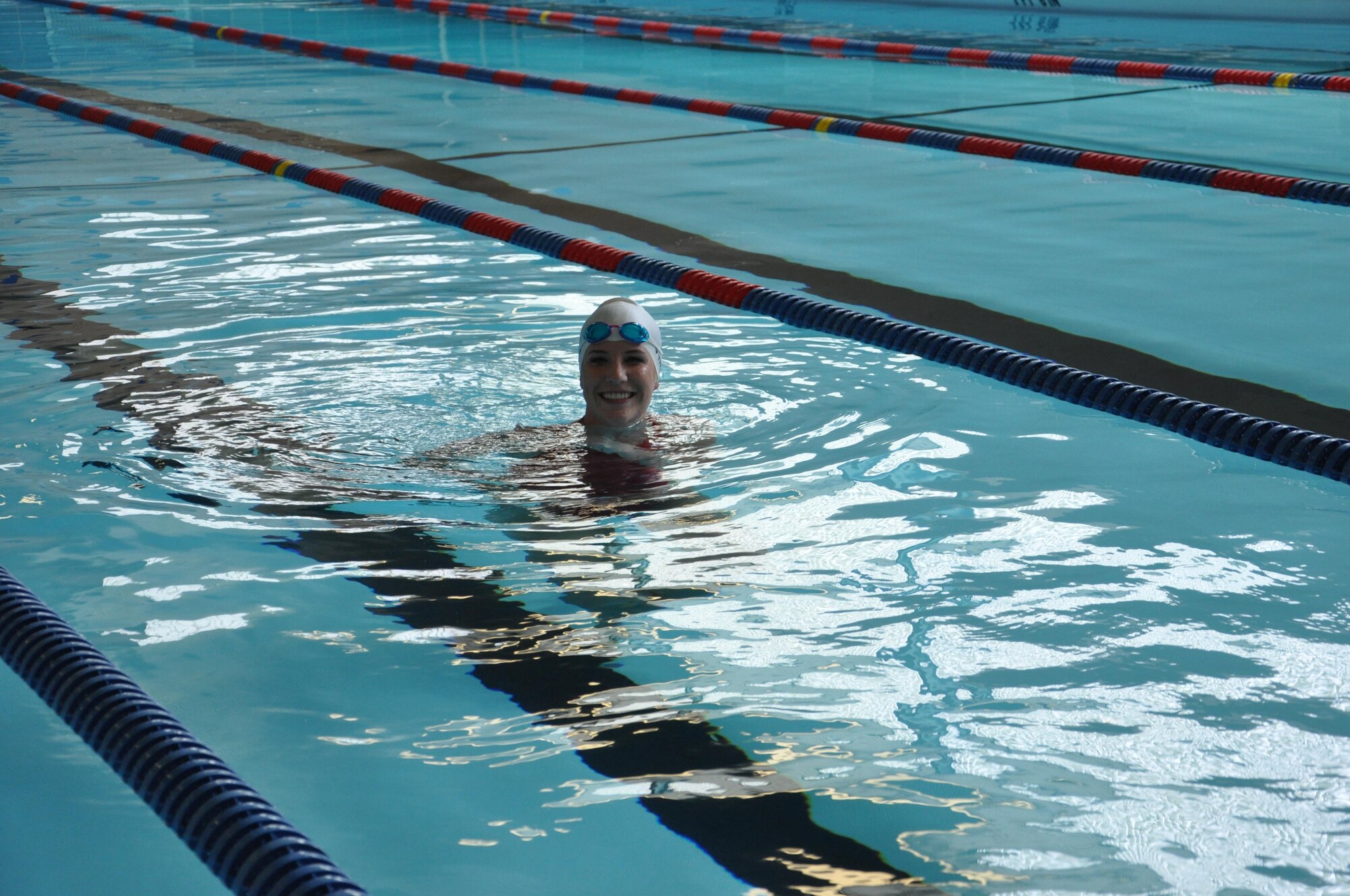 Staff Sgt. Lynley Mainous, 126th Intelligence Squadron in Springfield, Ohio, finishes a lap at the Dodge Fitness Center on Wright-Patterson AFB, Ohio, after it reopened April 10, 2017.  Mainous was one of the first patrons to use the upgraded pool, which had a new liner and deck installed.  The pool was closed for 2 1/2 months for the project. The liner has all of the required markings, a non-slip surface and is more ascetically pleasing. The surrounding deck took care of problem areas and safety hazards like standing water, missing or chipped tiles and lime and calcium build-up. (U.S. Air Force photo/Jim Mitchell)