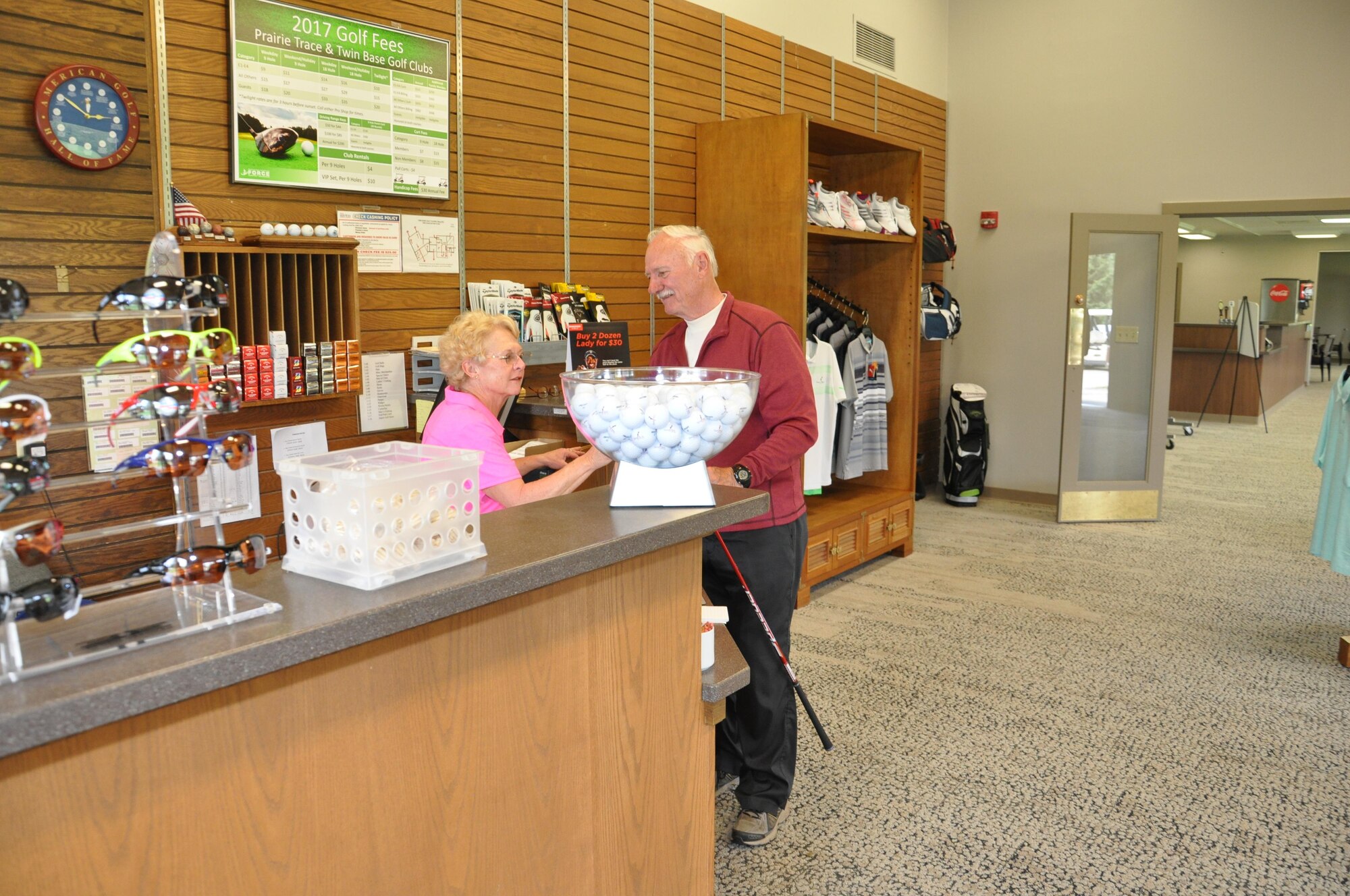 Roger Smith of Beavercreek, Ohio, talks with Customer Service Representative Gail Longo about a new driver at the Twin Base golf course April 10, 2017. The clubhouse facility was upgraded with new carpet, display racks, and snack bar furniture. The upgrades began in January 2017 and were completed in March 2017. Officials are also hoping to refurbish the sand traps on the course within the next year, similar to the project that was recently completed on the Prairie Trace golf course. (U.S. Air Force photo/Jim Mitchell)