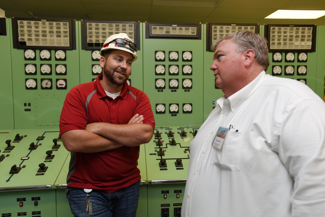 John Bell (Left), power plant trainee, speaks Greg Brown, plant manager with the Georgia Power Company, during a tour of the Old Hickory Dam powerhouse control room in Old Hickory, Tenn., April 19, 2017. Brown visited the facility while attending the 40th Annual Joint Hydropower Conference in Nashville Tenn.