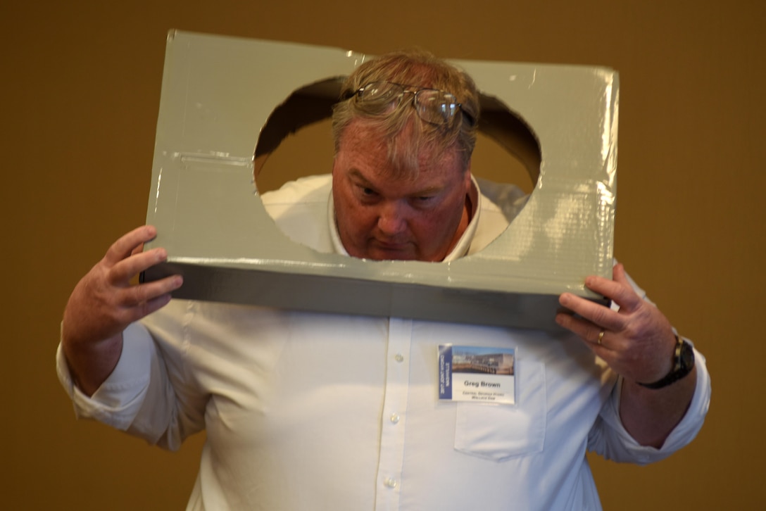 Greg Brown, plant manager with the Georgia Power Company, demonstrates the size of the entry hold into confined spaces at Lloyd Shoals Dam Powerhouse in Jackson, Ga. He provided a technical briefing on a project his team accomplished to add access tunnels into the turbines during the 40th Annual Joint Hydropower Conference April 19, 2017 in Nashville Tenn.