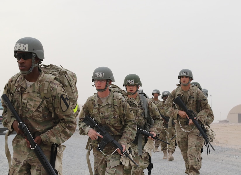 U.S. Servicemembers march toward the day 10 rappel tower at the Air Assault Course, April 12, 2017, at Camp Buehring, Kuwait. The Air Assault Course is a 12-day class that allows U.S. military personnel in the U.S. Army Central area of operations the unique opportunity to become air assault qualified, while deployed outside the continental United States.