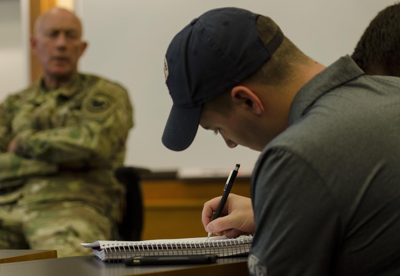 Lars Keeley, a ROTC cadet at Wake Forest University, takes notes during a Q&A session with Lt. Gen. Charles D. Luckey, Chief, Army Reserve & Commanding General, U.S. Army Reserve Command, at the Wake Forest University School of Business in Winston Salem, North Carolina, April 18, 2017, during a Q&A session. Wake Forest's law school has used the “Conversation with...” format for campus visitors over the past decade as a way of creating a comfortable and interactive atmosphere with the students, rather than having a scripted conversation. The university's business school chose to use the same model for Luckey's visit. (U.S. Army Reserve photo taken by Sgt. Stephanie Ramirez/Released)
