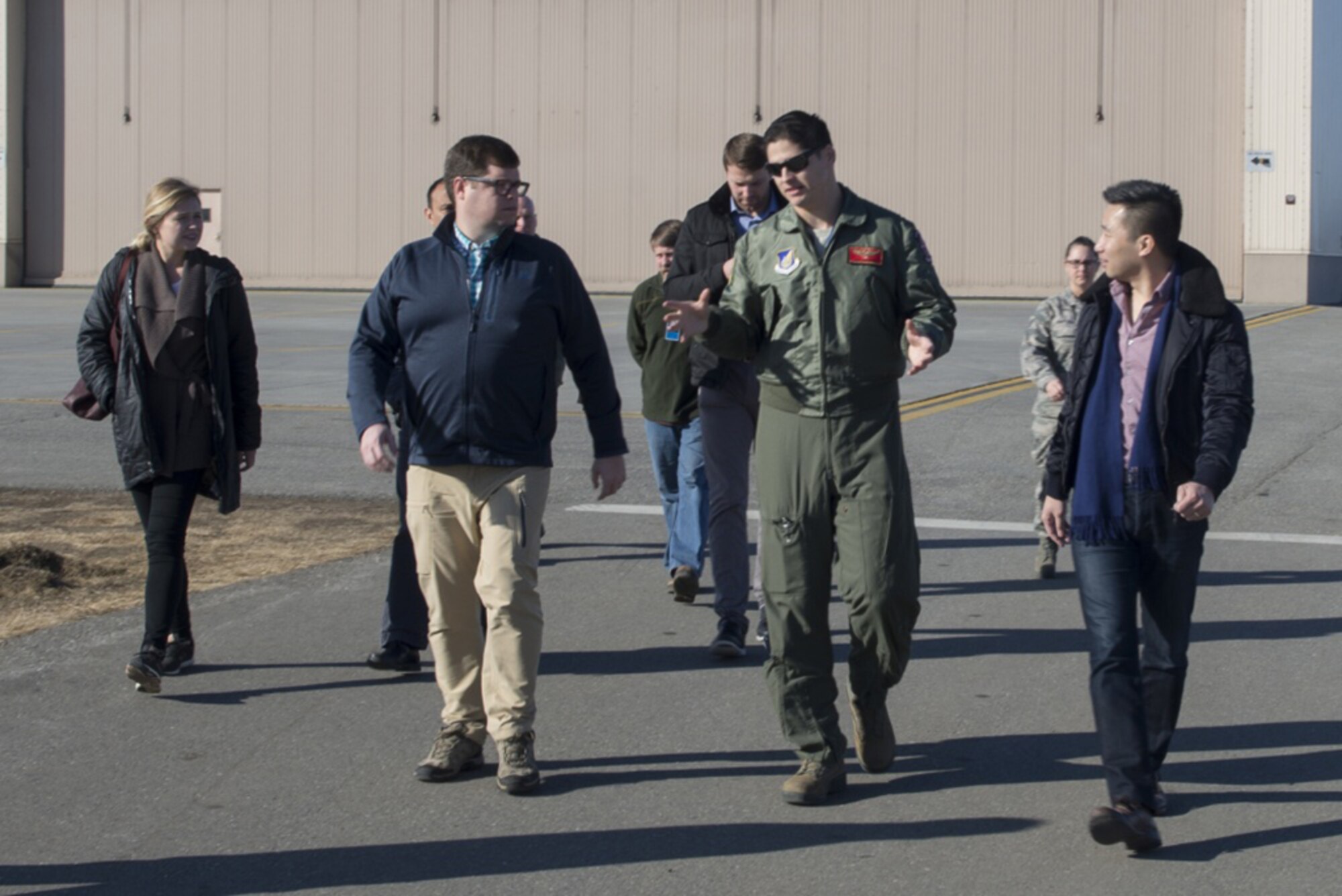 U.S. Air Force Capt. Jack Johnston, an 18th Aggressor Squadron F-16 Fighting Falcon aircraft pilot, speaks with Congressional staff delegates 18 April, 2017, at Eielson Air Force Base, Alaska. One stop during the base tour involved a static display of the F-16, which recently received the new “Splinter” pattern. 
