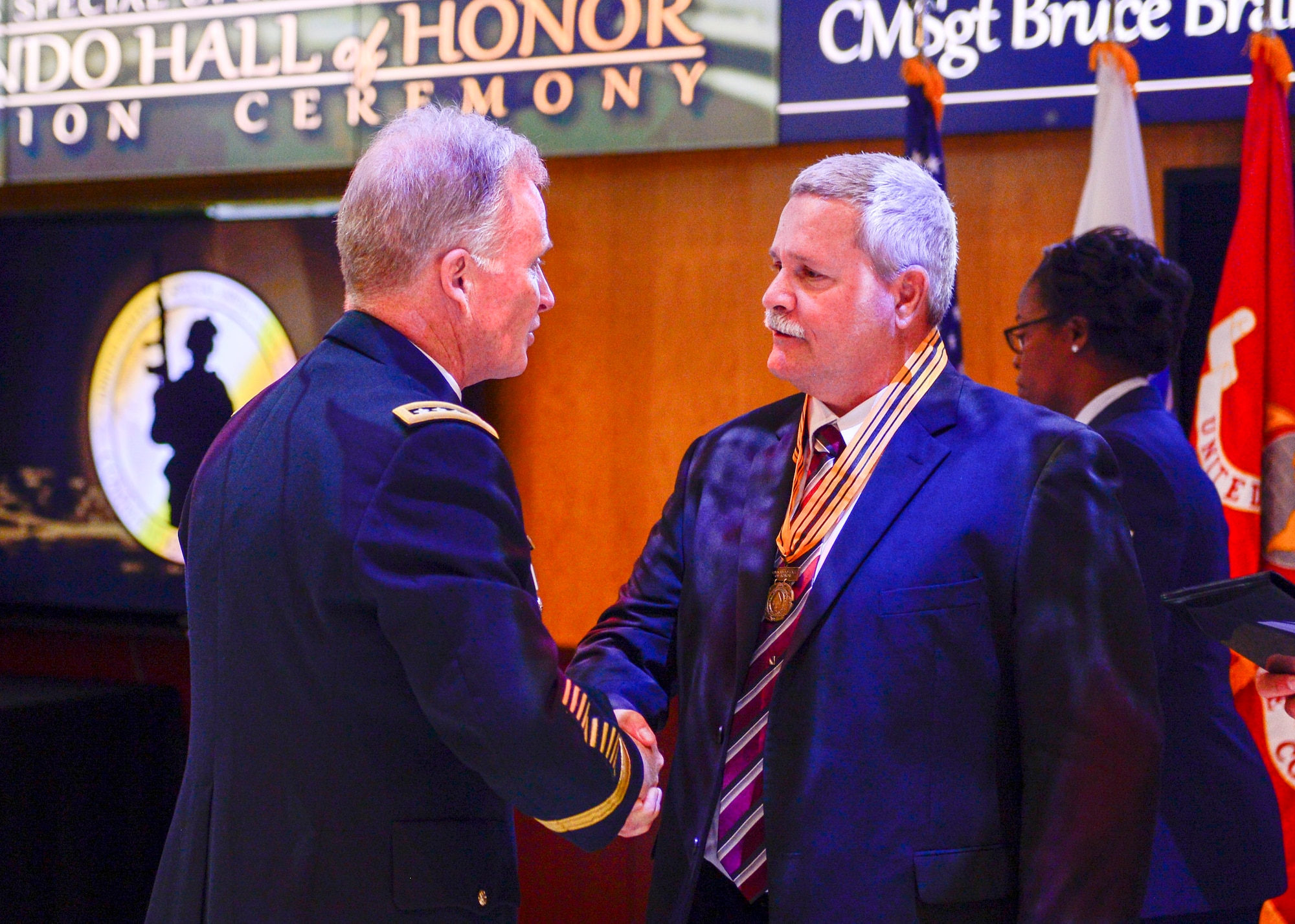 Army Gen. Raymond A. Thomas, USSOCOM commander, and Command Sgt. Maj. Patrick L. McCauley, USSOCOM command senior enlisted adviser recognizes Chief Master Sgt. Bruce Brandewie during the 2017 Commando Hall of Honor Ceremony located at the USSOCOM headquarters, MacDill Air Force Base, Florida, April 18.  CMSgt  Brandewie embody the skills, values, spirit and courage of a Special Operations Forces Warrior and was one of the seven inductees that were honored during this ceremony.  