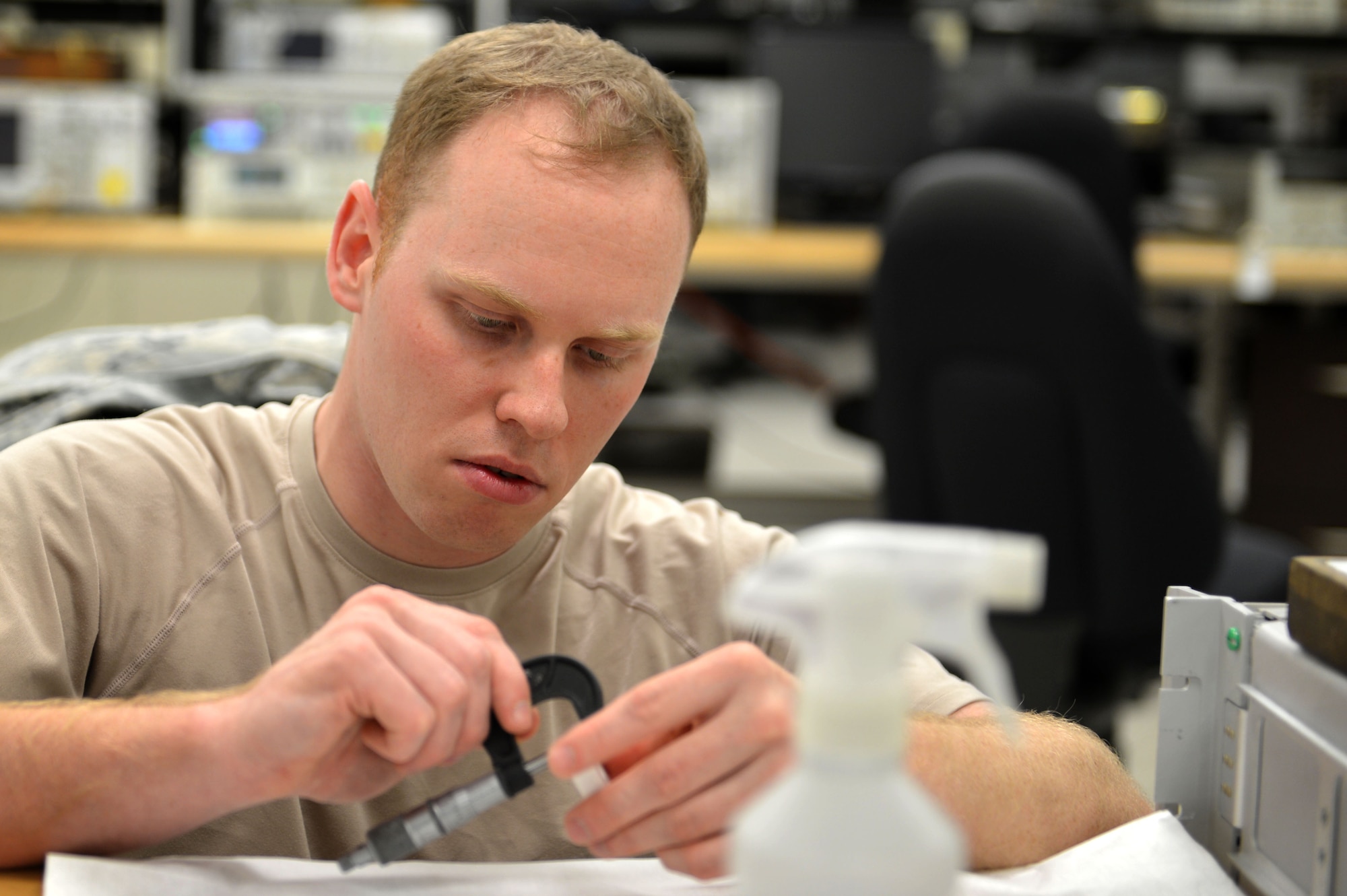 U.S. Air Force Staff Sgt. Kristopher Willms, 20th Component Maintenance Squadron precision measurement equipment laboratory (PMEL) test measurement and diagnostic equipment craftsman, calibrates a micrometer at Shaw Air Force Base, S.C., April 21, 2017. A micrometer gives 20th CMS PMEL Airmen the ability to linearly measure equipment accurately to one-one-thousandth of an inch. (U.S. Air Force photo by Airman 1st Class Christopher Maldonado)