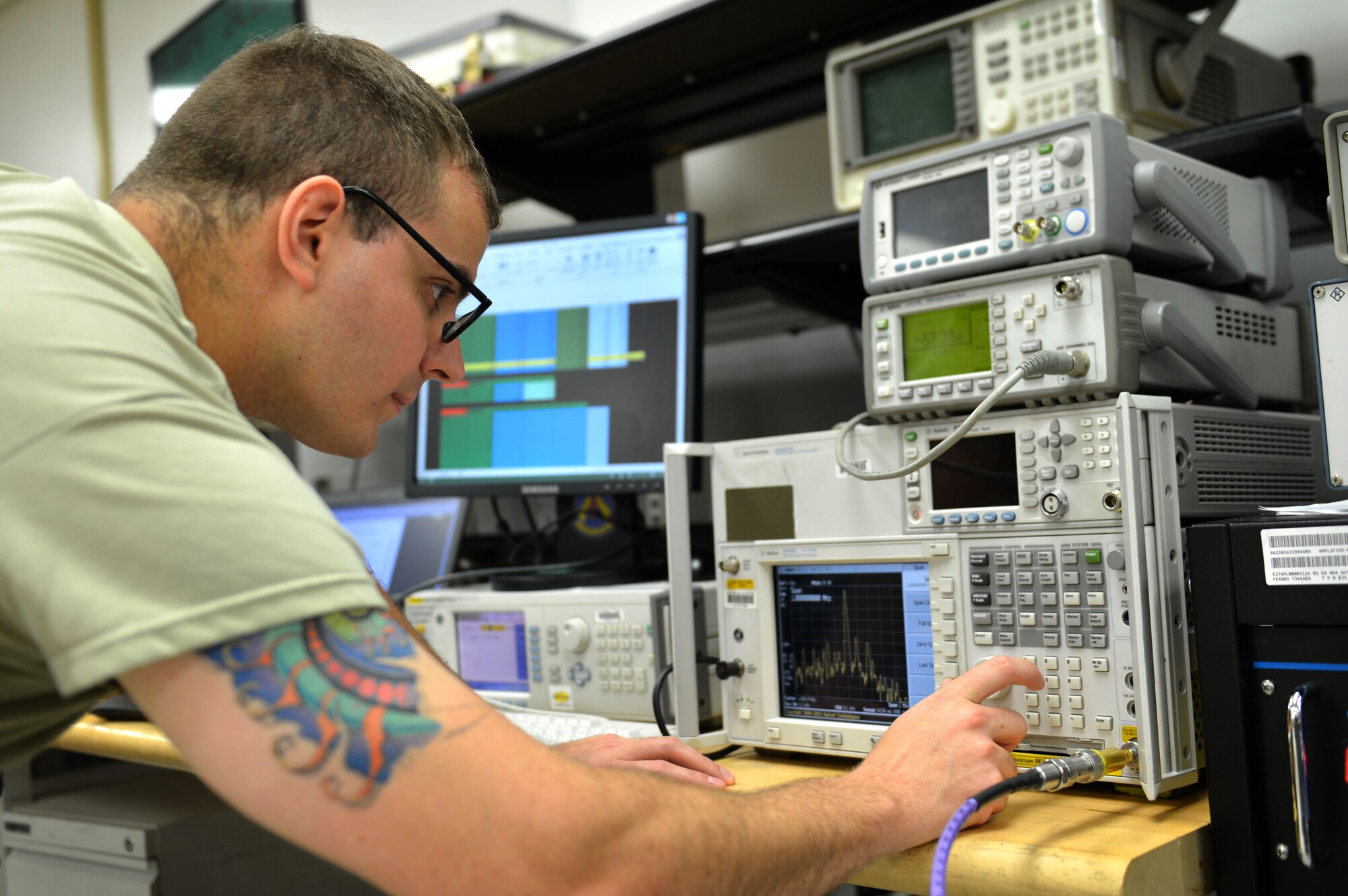 U.S. Air Force Staff Sgt. Timothy Miller, 20th Component Maintenance Squadron precision measurement equipment laboratory (PMEL) test measurement and diagnostic equipment craftsman, calibrates a power amplifier at Shaw Air Force Base, S.C., April 21, 2017. Airmen assigned to the 20th CMS PMEL flight adjust weaponry systems and hardware for space and ground-bound assets in support of the Air Force mission. (U.S. Air Force photo by Airman 1st Class Christopher Maldonado)