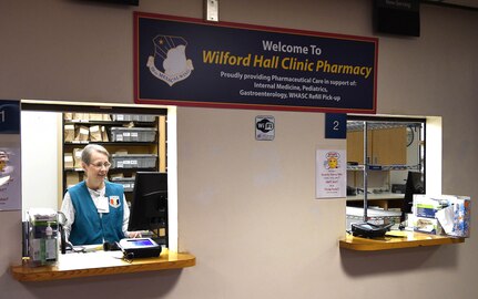 Wilford Hall volunteer Susan Deason helps out in the Wilford Hall Clinic Pharmacy on Joint Base San Antonio-Lackland, Texas, April 12, 2017. Volunteers in the pharmacy help dispense hundreds of medications for beneficiaries and often work at customer service windows. (This photo was altered for security purposes)