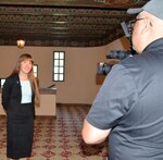 Monika Korra, author and sexual assault survivor, does an interview for a local TV station before she spoke about her experience as a sexual assault survivor in front of an audience of military leaders, active-duty members and government civilians April 18 at the Joint Base San Antonio-Fort Sam Houston Post Theater.