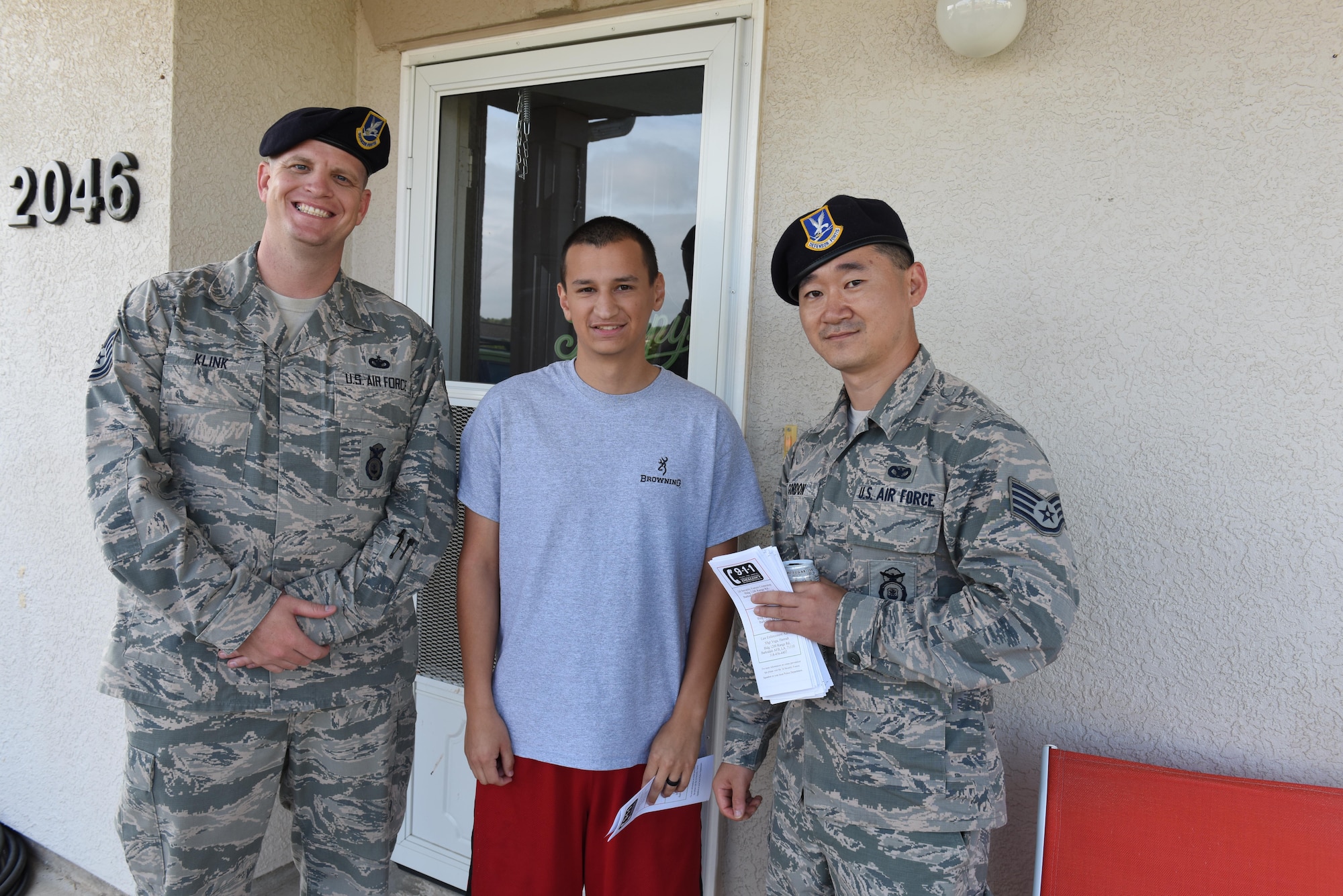 Defenders from the 2nd Security Forces Squadron went door to door on Barksdale’s East Reservation Housing division as part of a community policing initiative, April 15, 2017. The goal of the initiative was to make Barksdale residents aware of community policing measures and to build trust and camaraderie between 2nd SFS and the Barksdale community. (U.S. Air Force photo/Senior Airman Luke Hill)