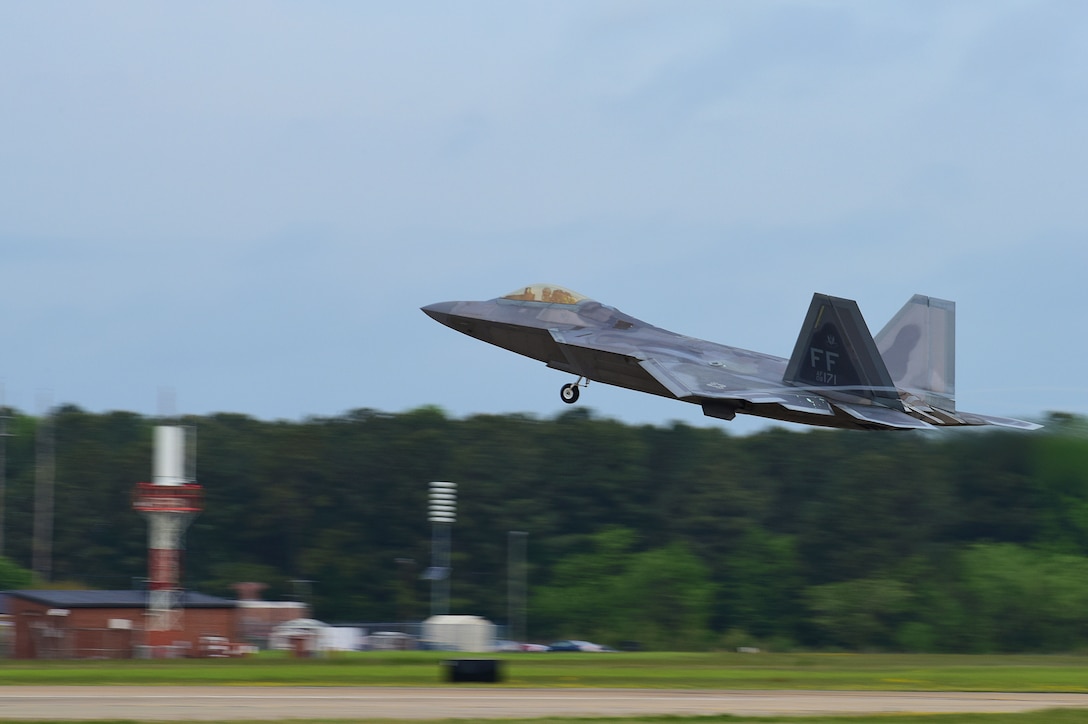 A U.S. Air Force F-22 Raptor takes off during ATLANTIC TRIDENT 17 at Joint Base Langley-Eustis, Va., April 20, 2017. This exercise provides Airmen and international partners an opportunity to experience realistic combat scenarios that enhance their ability to effectively fight together in today’s environments. (U.S. Air Force Photo/Airman 1st Class Tristan Biese)