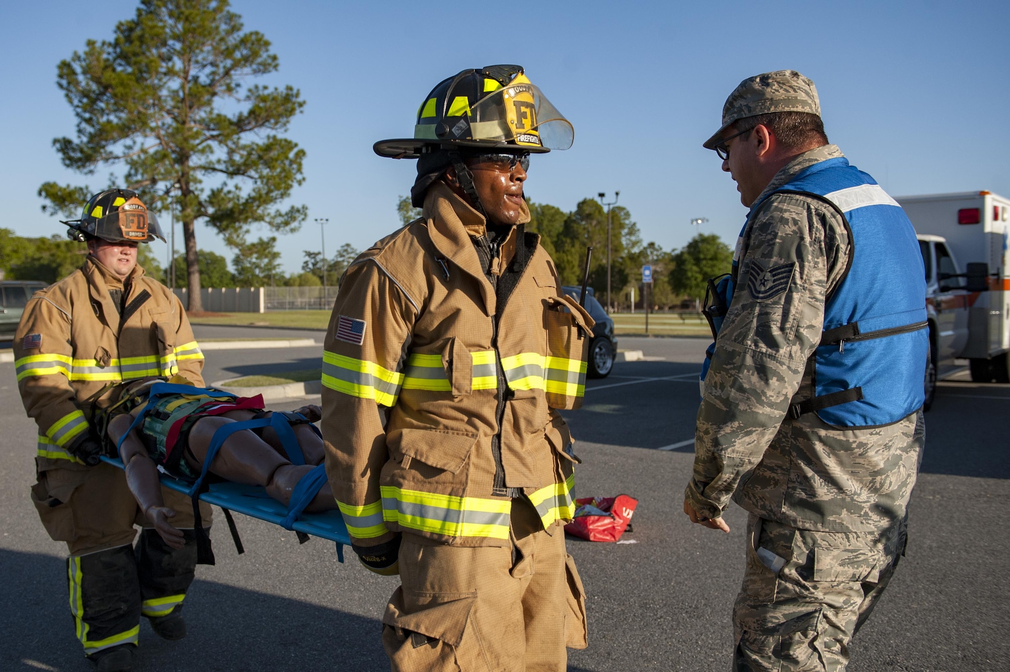 Moody firefighters carry a stimulated victim to a triage site during a natural disaster exercise, April 19, 2017, at Moody Air Force Base, Ga. The exercise tested the wing’s ability to evacuate aircraft, secure assets and respond to emergency situations in the event of a real-world natural disaster. (U.S. Air Force photo by Airman 1st Class Lauren M. Sprunk)