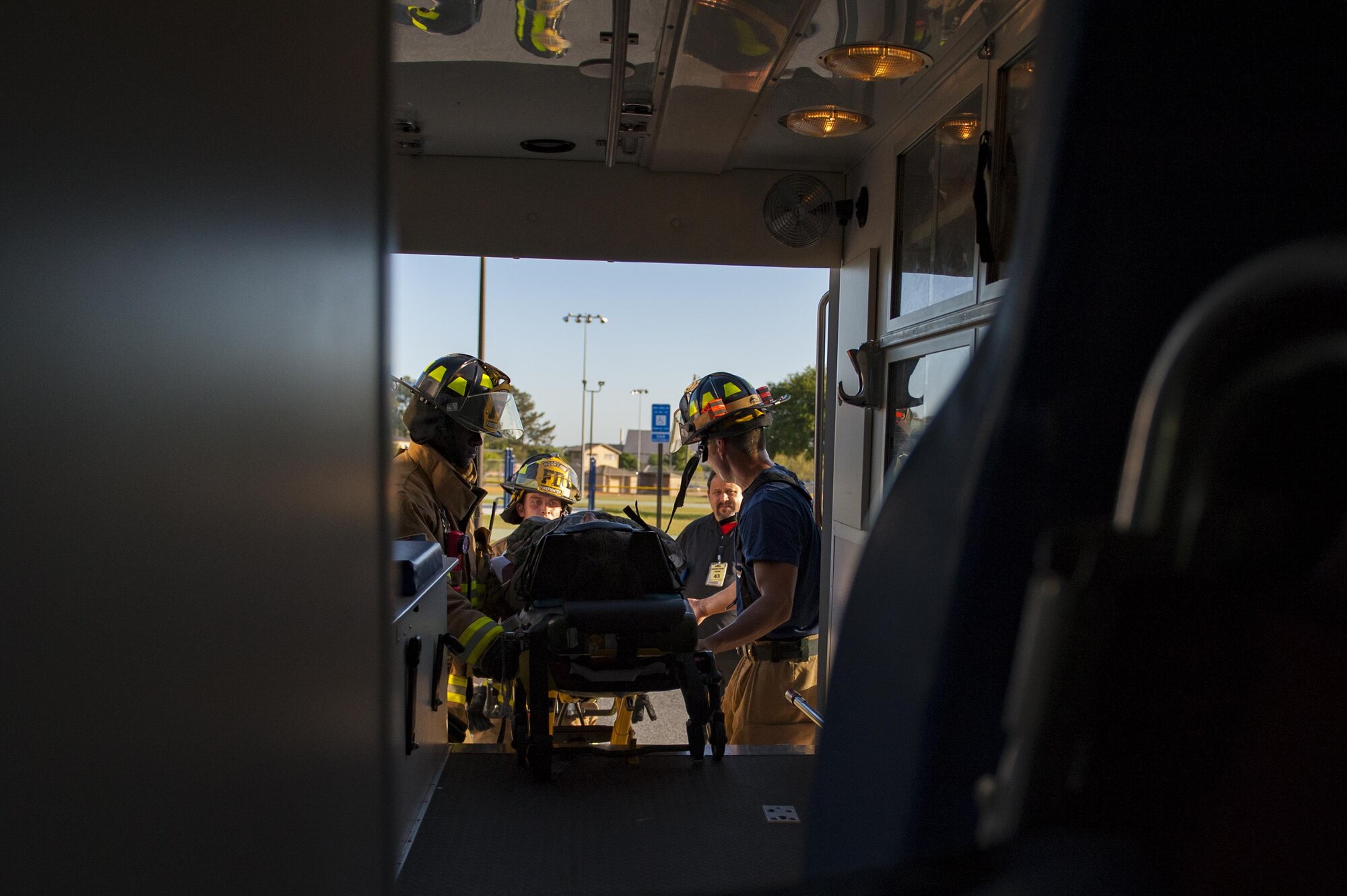 Moody firefighters lift a stimulated victim into an ambulance, April 19, 2017, at Moody Air Force Base, Ga. The exercise tested the wing’s ability to evacuate aircraft, secure assets and respond to emergency situations in the event of a real-world natural disaster. (U.S. Air Force photo by Airman 1st Class Lauren M. Sprunk)