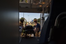 Moody firefighters lift a stimulated victim into an ambulance, April 19, 2017, at Moody Air Force Base, Ga. The exercise tested the wing’s ability to evacuate aircraft, secure assets and respond to emergency situations in the event of a real-world natural disaster. (U.S. Air Force photo by Airman 1st Class Lauren M. Sprunk)