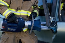 A Moody firefighter uses the jaws of life to break open a car door during a natural disaster exercise, April 19, 2017, at Moody Air Force Base, Ga. The exercise tested the wing’s ability to evacuate aircraft, secure assets and respond to emergency situations in the event of a real-world natural disaster. (U.S. Air Force photo by Airman 1st Class Lauren M. Sprunk)