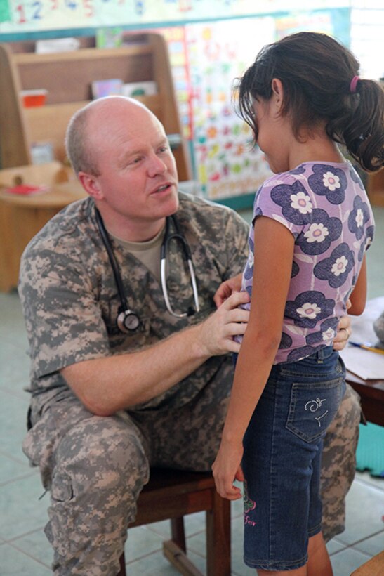 Lt. Col. Marcus Blackburn, a pediatrician with the Utah Medical Command, evaluates a young patient at Liberty Children's Home April 18, 2017, during a community relations event held in Ladyville, Belize as part of Beyond the Horizon 2017.  BTH 2017 is a partnership exercise between the Government of Belize and U.S. Southern Command that will provide three free medical service events and five construction projects throughout the country of Belize from March 25 until June 17. (U.S. Army Photo by Staff Sgt. Fredrick Varney, 131st Mobile Public Affairs Detachment)
