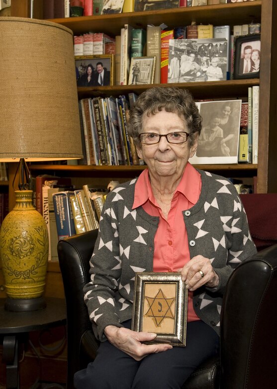 Kitty Saks, a Holocaust survivor who also lost 27 family members, was placed into a Catholic convent, at age nine, under an assumed name, Rosette Nizolle, for her safety and became a hidden child of the Holocaust. This year’s theme for the Holocaust Days of Remembrance commemoration is “Learning from the Holocaust: The Strength of the Human Spirit” and will be held April 23 through April 30, 2017. (U.S. Air Force photo/A1C Kaylee Dubois.
