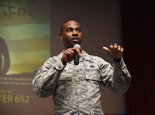 Tech. Sgt. Glenn Davis, 335th Training Squadron personnel apprentice course NCO in charge, welcomes Airmen from the 81st Training Group to the Airmen Building Airmen Symposium at the Welch Theater April 21, 2017, on Keesler Air Force Base, Miss. The Air Force Sergeants Association Chapter 652, sponsored the event designed to inspire young Airmen and help them develop their leadership skills.  (U.S. Air Force photo by Kemberly Groue)