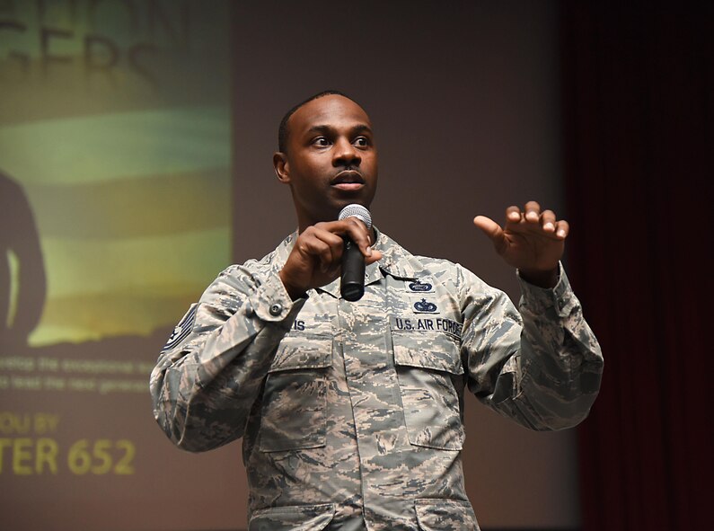 Tech. Sgt. Glenn Davis, 335th Training Squadron personnel apprentice course NCO in charge, welcomes Airmen from the 81st Training Group to the Airmen Building Airmen Symposium at the Welch Theater April 21, 2017, on Keesler Air Force Base, Miss. The Air Force Sergeants Association Chapter 652, sponsored the event designed to inspire young Airmen and help them develop their leadership skills.  (U.S. Air Force photo by Kemberly Groue)