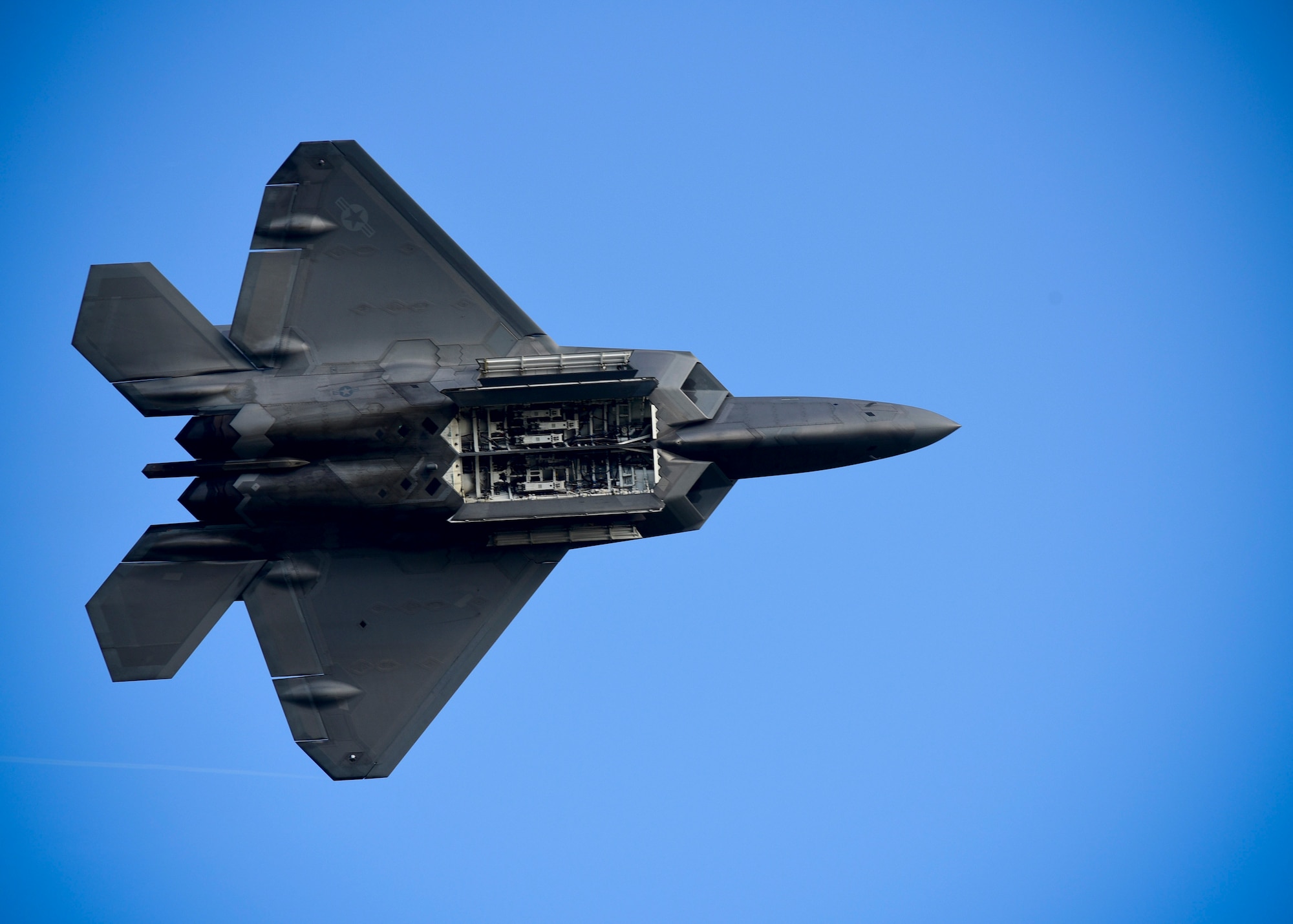 U.S. Air Force Maj. Daniel Dickinson, F-22 Raptor Demonstration Team pilot, does a fly-by during the ATLANTIC TRIDENT 17 World War I Remembrance Day at Joint Base Langley-Eustis, Va., April 21, 2017. The Raptor performs both air-to-air and air-to-ground missions, allowing full realization of operational concepts vital to the 21st century Air Force. The event also included a demonstration by the French air force’s Dassault Rafale and aerial demonstration team, Patrouille de France. (U.S. Air Force photo/Staff Sgt. Areca T. Bell) 